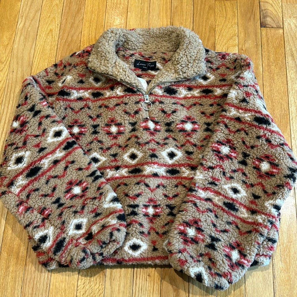 Tan printed sweater, size small.